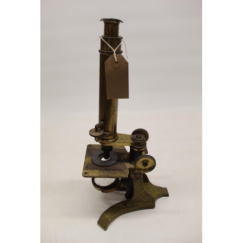 221 - C19th lacquered brass microscope on triform base, no visible maker, H37cm