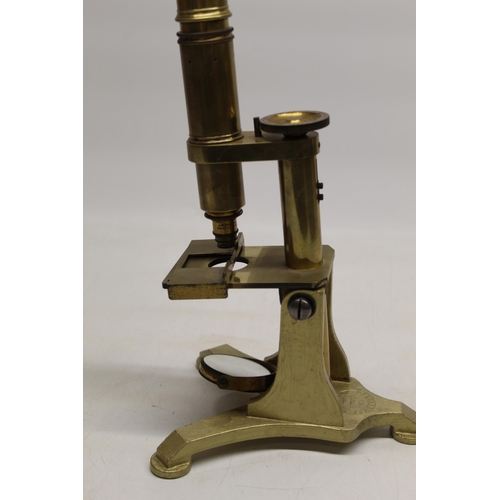 222 - J.B. Dancer Manchester - C19th lacquered brass microscope on cast triform base bearing makers mark, ... 