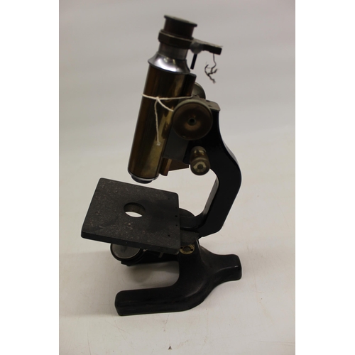 224 - C20th brass and japanned microscope on triform base, no visible maker, H33cm