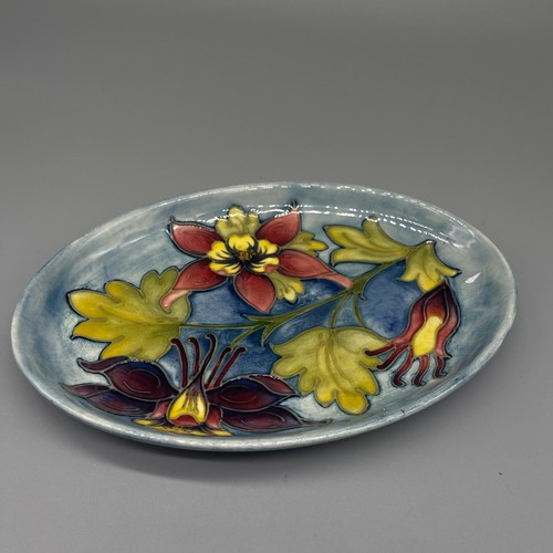 200 - Moorcroft Pottery: Columbine pattern oval dish, tube lined with purple, red and yellow flowers on gr... 