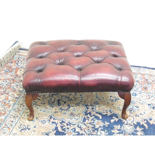 334 - Chesterfield style footstool with deep buttoned burgundy leather top on cabriole legs, W60cm