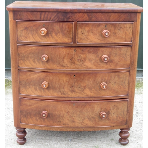 739 - Victorian mahogany bow front chest of two short and three long cockbeaded drawers with turned wood h... 