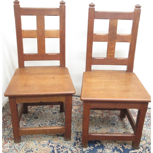 773 - Pair of C20th oak Gothic style side chairs, with angular finials and faceted square panel back, soli... 