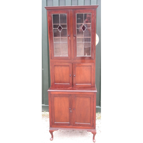 766 - Early C20th mahogany side cabinet, with two lead glazed doors above a pair of panel doors, projectin... 