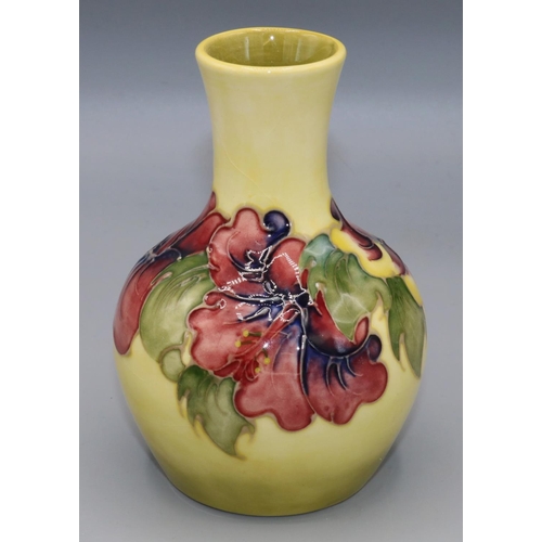 208 - Moorcroft Pottery: Hibiscus pattern baluster vase, tube lined with pink and purple flowers on yellow... 