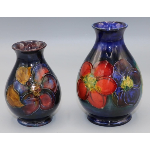 211 - Moorcroft Pottery: Clematis pattern vases, H11.5cm and H9.5cm (2)