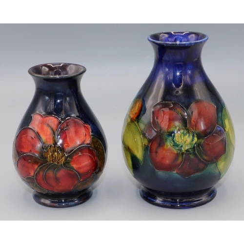 211 - Moorcroft Pottery: Clematis pattern vases, H11.5cm and H9.5cm (2)