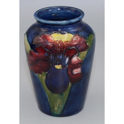 212 - Moorcroft Pottery: Floral pattern baluster vase, tube lined with purple and yellow flowers on dark b... 