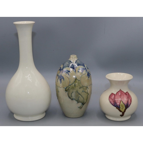 213 - Moorcroft Pottery: Magnolia pattern vase, H9cm; autumn leaf design vase with Queen Mary sticker, H21... 