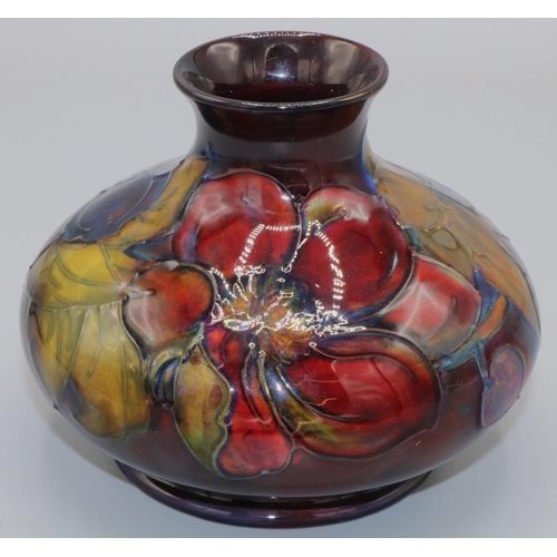 215 - Moorcroft Pottery: Flambe Clematis pattern squat vase, tube lined with purple and red flowers on mar... 