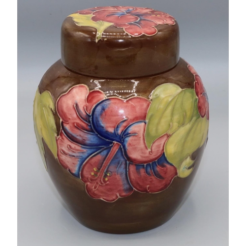 215A - Moorcroft Pottery: Hibiscus pattern ginger jar and cover, tube lined with red and blue flowers on br... 