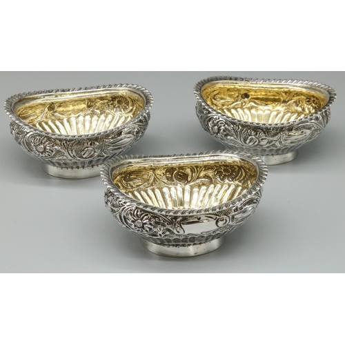 1206 - Set of three Victorian hallmarked silver oval salts, part lobed with floral band, gadrooned rim and ... 