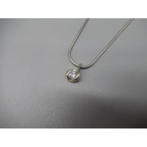 1209 - Unmarked white metal solitaire pendant set with brilliant cut diamond on 9ct white gold chain, stamp... 