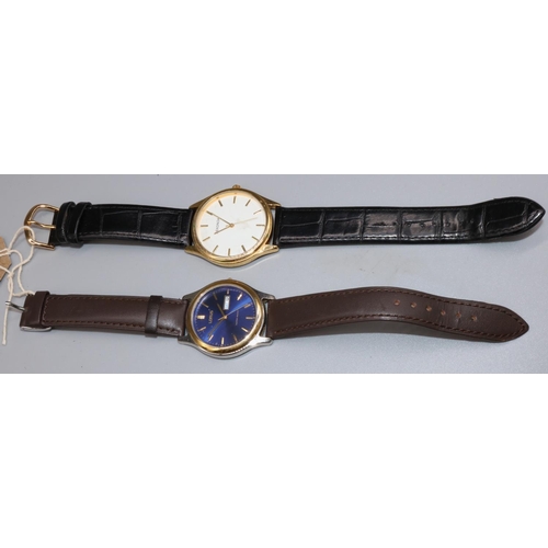 1222 - Lorus stainless steel quartz wristwatch with day date, signed blue dial with applied baton hours and... 