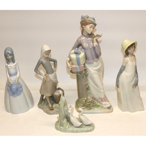 1325 - Lladro figure of a girl with milk pail and duck, H24cm; Nao figure group of three ducks; and three s... 