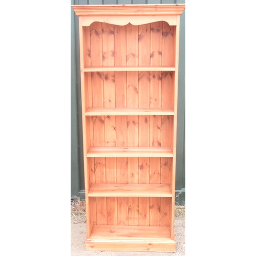 805 - Modern pine bookcase with moulded cornice and four shelves on plinth base, W77cm D27cm H184cm