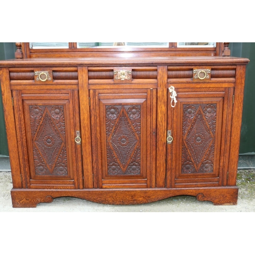 743 - Victorian oak mirror back sideboard, with arched cornice and three mirror plates above three drawers... 