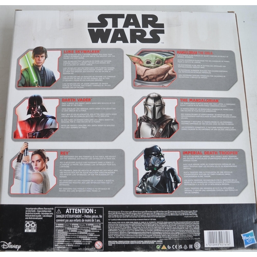 152 - Hasbro Star Wars action figure set featuring Luke, Vader, Rey and Mandalorian characters