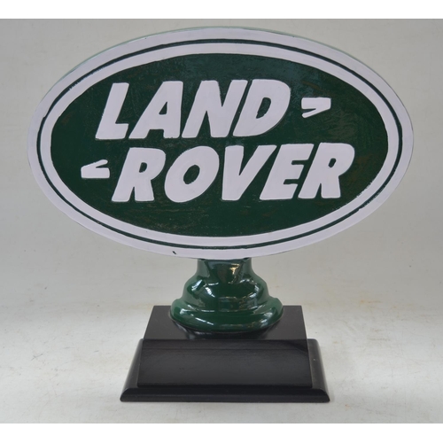 177 - WITHDRAWN - Relief cast metal Land Rover sign on wood base, W40cm D13.5cm H37cm.