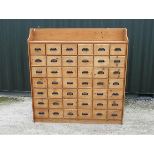 755 - Pine bank of 42 drawers, with galleried back and painted black cast metal drawer pulls, W66cm D30cm,... 