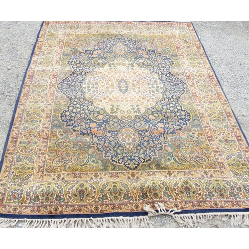 780 - Persian pattern multi pattern wool rug, with floral field and spandrels within repeating three strip... 