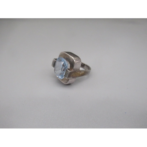 1243 - Silver modernist silver ring set with light blue stone, stamped 925, size O1/2, 14.1g