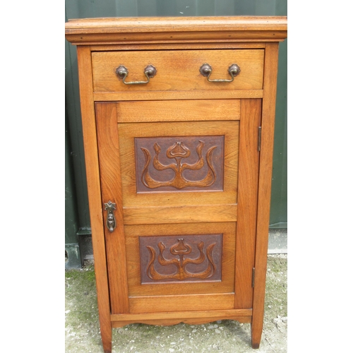 794 - C20th walnut side cabinet, single drawer above a door carved with Art Nouveau foliage, on square sup... 