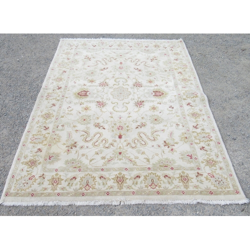 807 - Indian pattern rug, decorated with trailing foliage on a cream ground, 240cm x 173cm