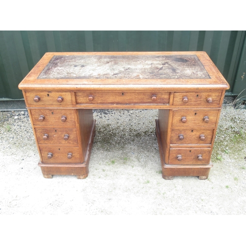 812 - Victorian oak twin kneehole desk, with inset leather writing surface, the three frieze and six pedes... 