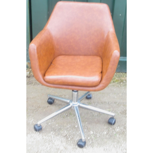 814 - Brown rexine upholstered office swivel arm chair, on chromed metal base with casters