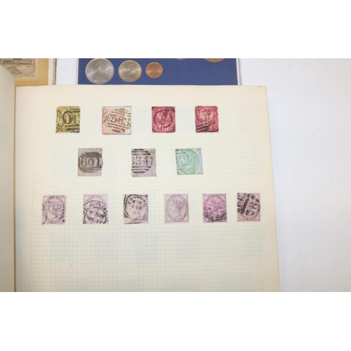 350 - Two world stamp albums, and a collection of commemorative coins