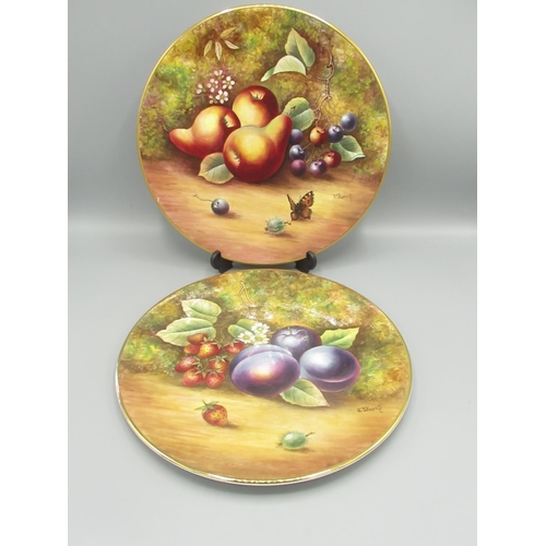 1414 - Pair of C20th porcelain plates, hand painted with summer fruits by J Skerrett (ex Royal Worcester), ... 