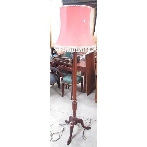 848 - George 111 style mahogany tripod standard lamp with lobed and fluted column and pink fringed shade, ... 