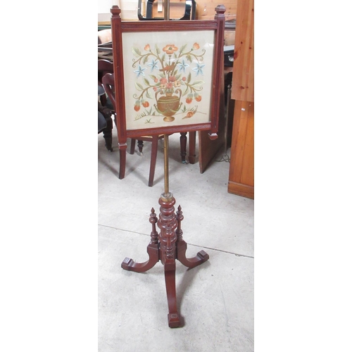 849 - Victorian mahogany tripod pole screen, with silkwork banner on brass column and three angular scroll... 