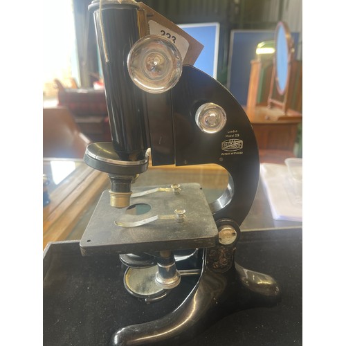 223 - R. & J. Beck Ltd London - Model 29 japanned microscope on triform base, base repaired, serial no.127... 