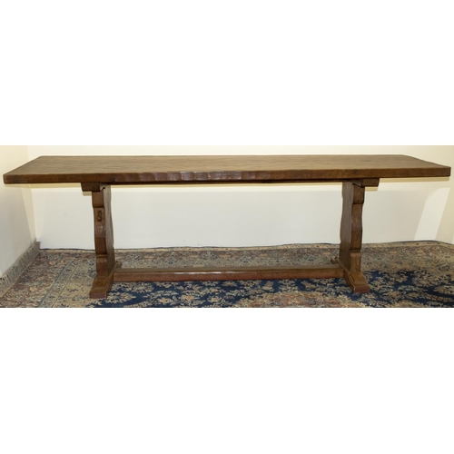 1351 - Robert Mouseman Thompson of Kilburn - a large oak refectory style dining table, the adzed pegged rec... 