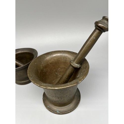 267 - Two C19th style patinated brass apothecary mortars and pestles