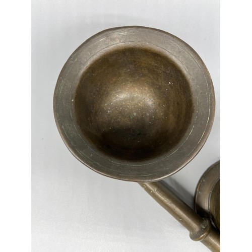 267 - Two C19th style patinated brass apothecary mortars and pestles