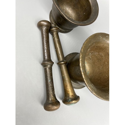 267 - Two C19th style patinated brass apothecary mortars and pestles