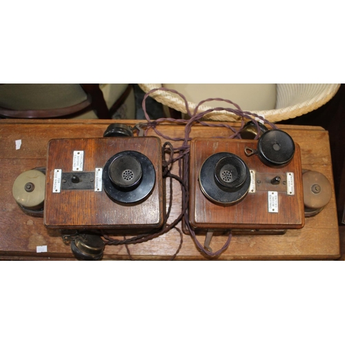 291 - Early C20th pair of wall mounted Ericsson oak cased signal box telephones, complete with original in... 