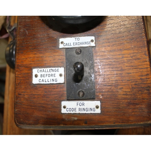 291 - Early C20th pair of wall mounted Ericsson oak cased signal box telephones, complete with original in... 