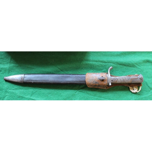 700 - Vintage World War I era Mauser bayonet with original sheath and frog. Blade length  37.1cm.