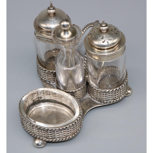 1071 - Victorian hallmarked silver four piece cruet stand, basket weave trefoil base with twist handle on t... 