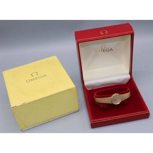 1038 - Omega - lady's 9ct gold quartz wristwatch, signed gold coloured textured dial with applied baton hou... 