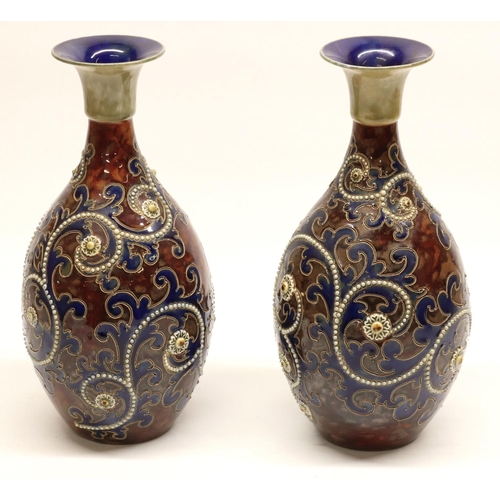 1150 - George Tinworth (1843-1913) For Doulton Lambeth, a pair of mallet shaped stoneware vases, with blue ... 