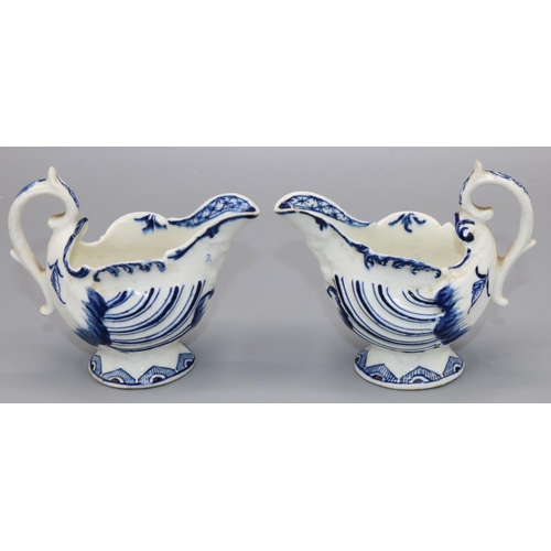 1143 - Two C18th Derby porcelain blue and white dolphin ewer shape cream jugs, with dolphin and trident mou... 