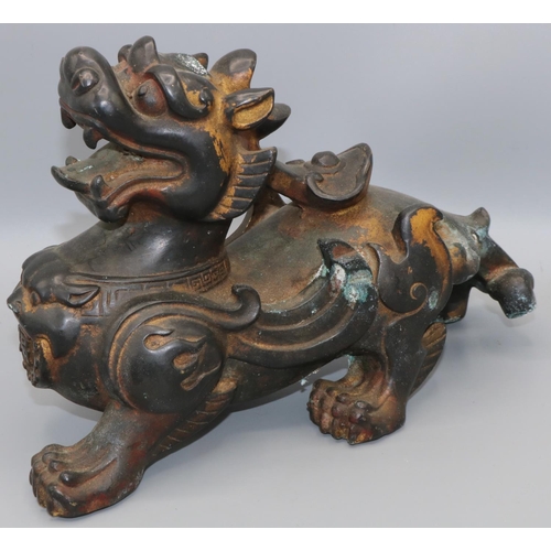 1103 - C20th Chinese patinated and parcel gilt bronze model of a Kylin, L29cm H18cm