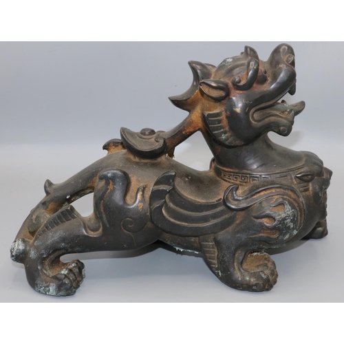 1103 - C20th Chinese patinated and parcel gilt bronze model of a Kylin, L29cm H18cm