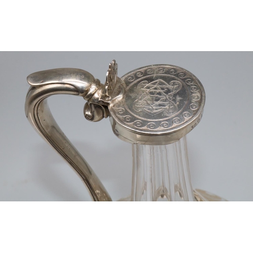 1061 - Victorian hallmarked silver mounted mallet shaped decanter, with faceted neck and etched scroll body... 