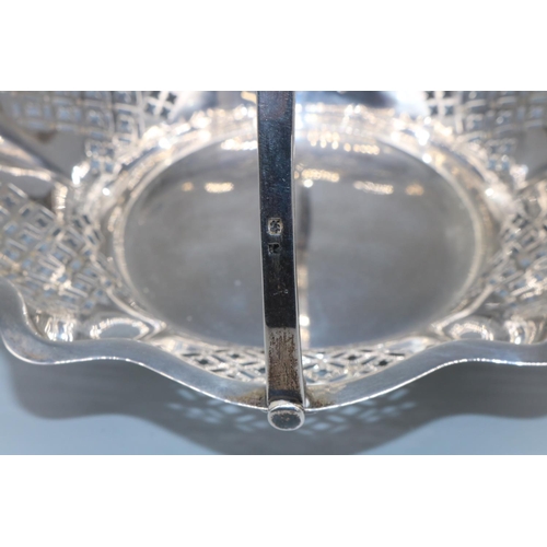 1059 - George V hallmarked silver circular cake basket, with geometrically pierced tapering sides and shape... 